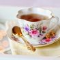 读者「午后茶渍」的头像，一只白瓷茶杯放在窗边的木桌上